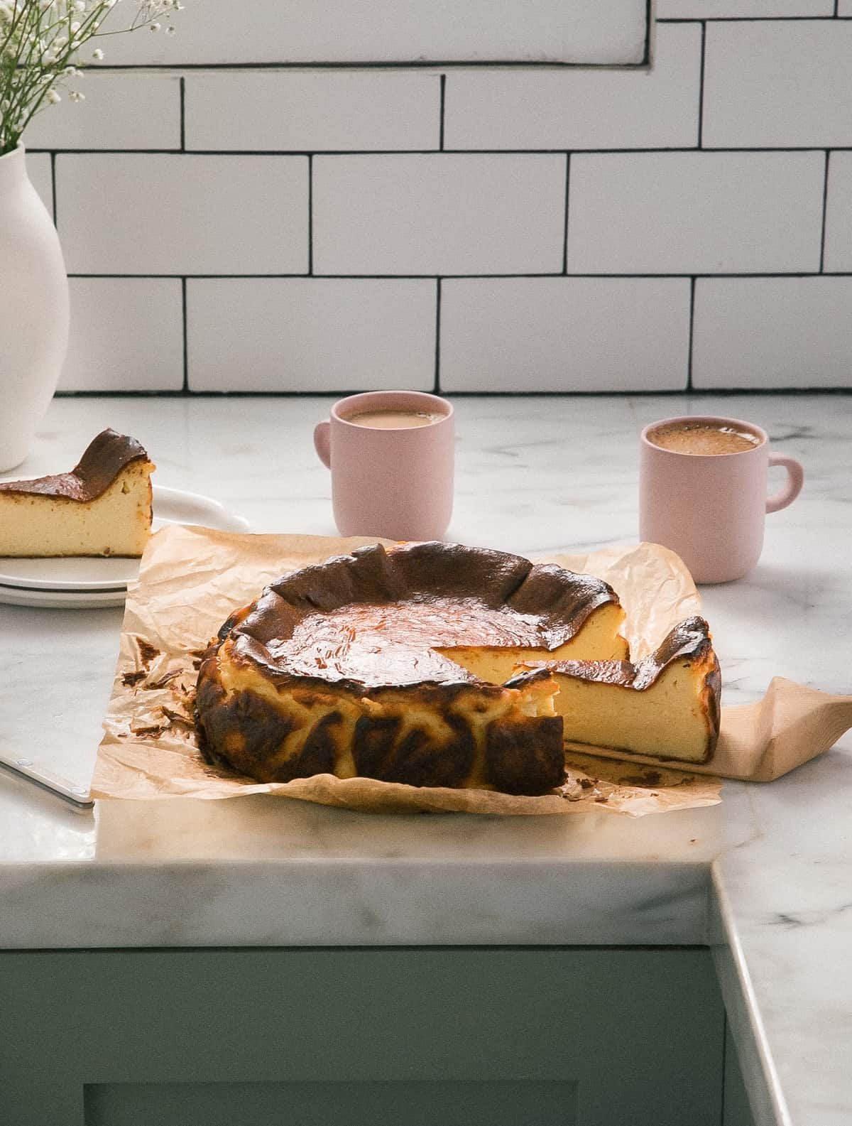 Basque cheese cake on counter slices.