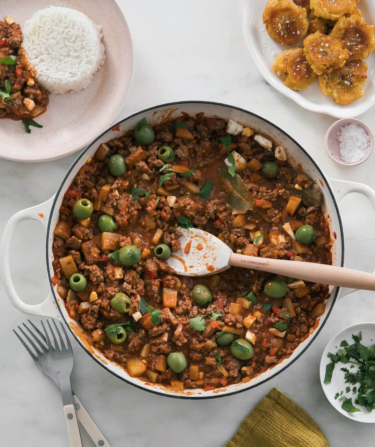 Picadillo in pot with Tostones on the side.
