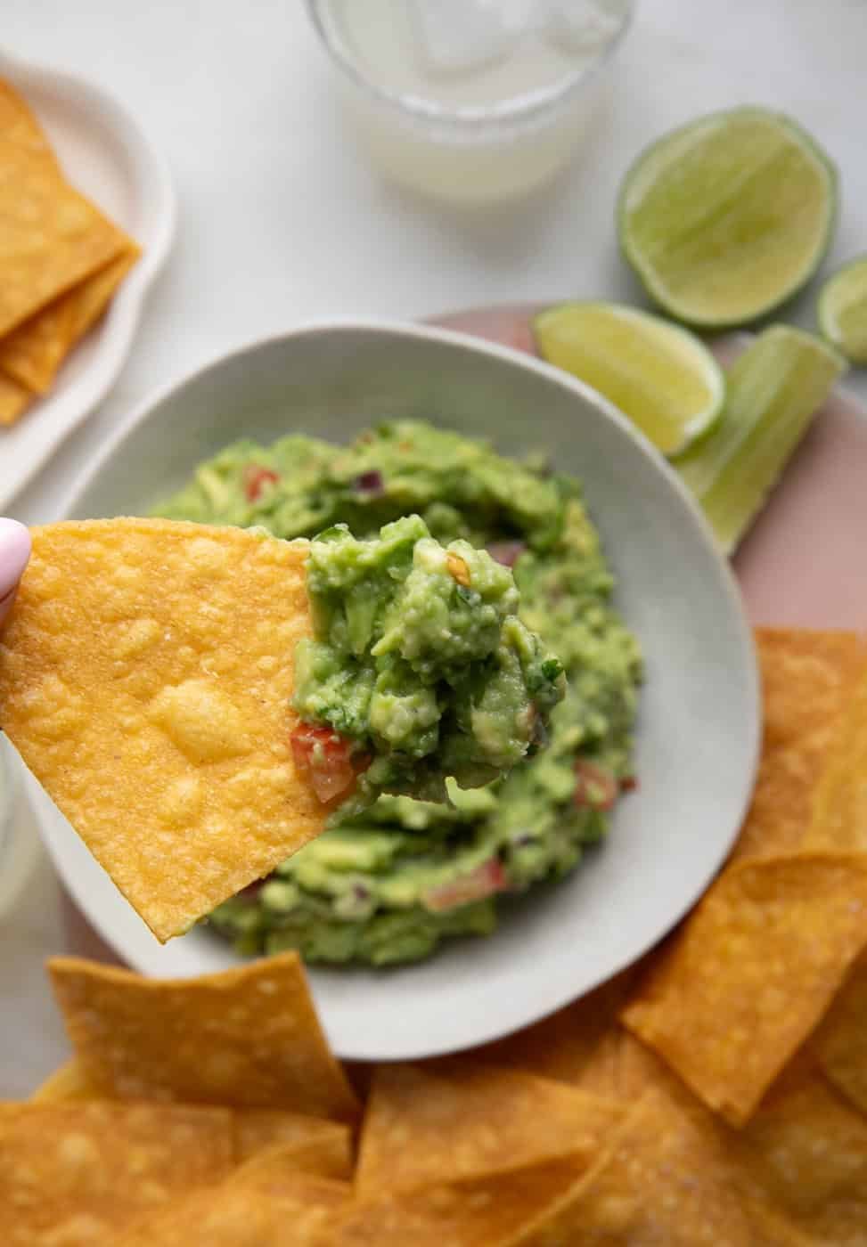 Homemade tortilla -chip dipped in guacamole. 