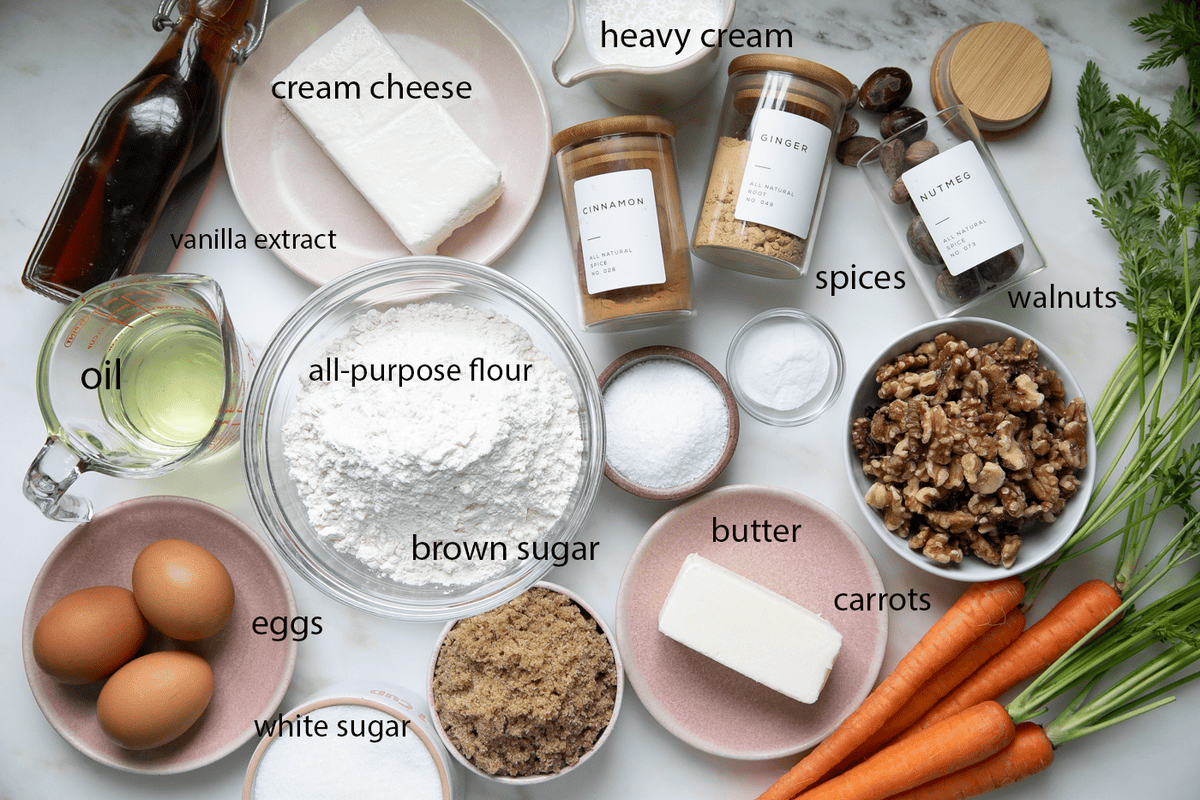 Ingredients for carrot cake on a counter labeled.